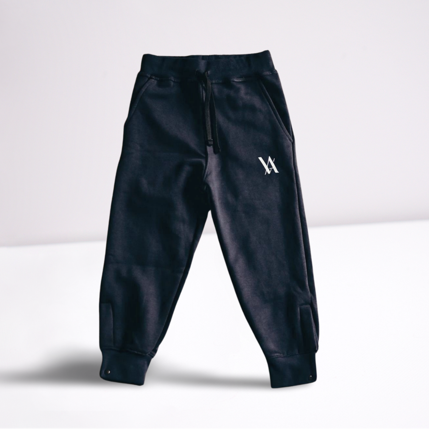 Navy jogger pants with a white VA logo and black drawstring.